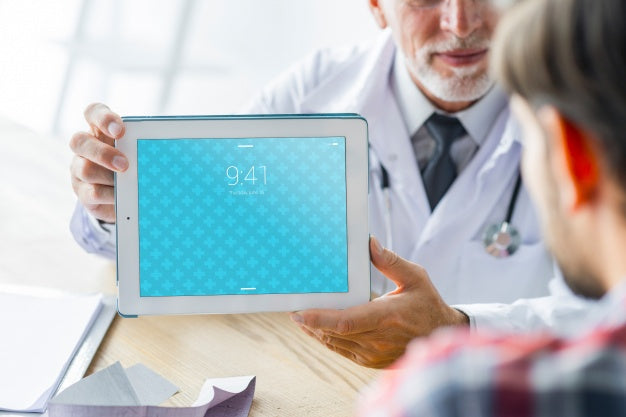 Doctor Showing Tablet To Patient Psd