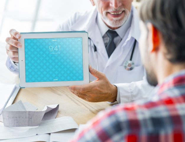 Doctor Showing Tablet To Patient Psd