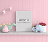 Doll On Shelf With Picture Frame Mockup Psd