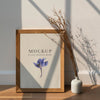 Dried White Statice Flower In A White Vase By A Wooden Frame Mockup On A Wooden Floor Psd