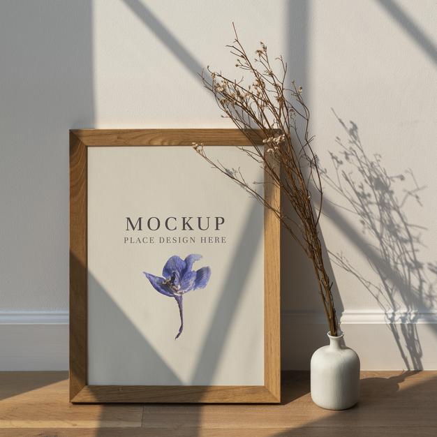 Dried White Statice Flower In A White Vase By A Wooden Frame Mockup On A Wooden Floor Psd