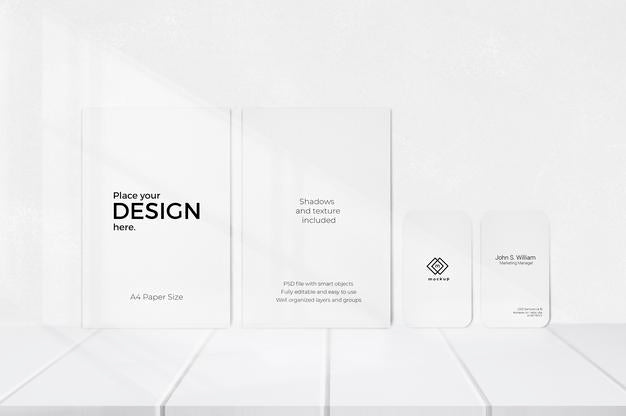 Editable Template Of Sheets And Visiting Cards In Front Of White Wall Psd