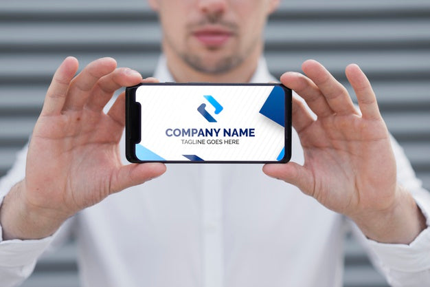 Elegant Business Man Holding Phone Mock-Up Psd