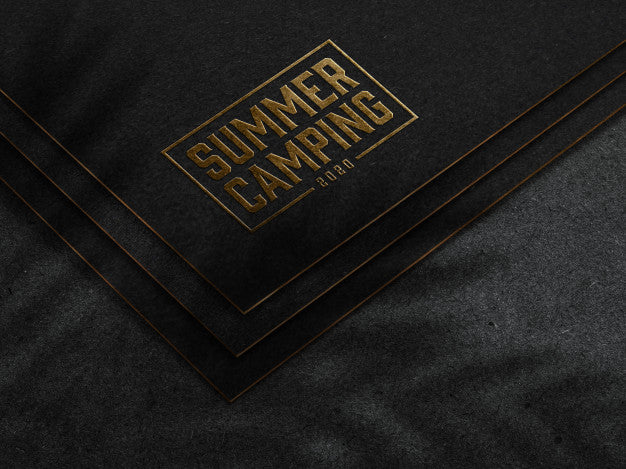 Embossed Gold Logo Mockup On Dark Paper Psd