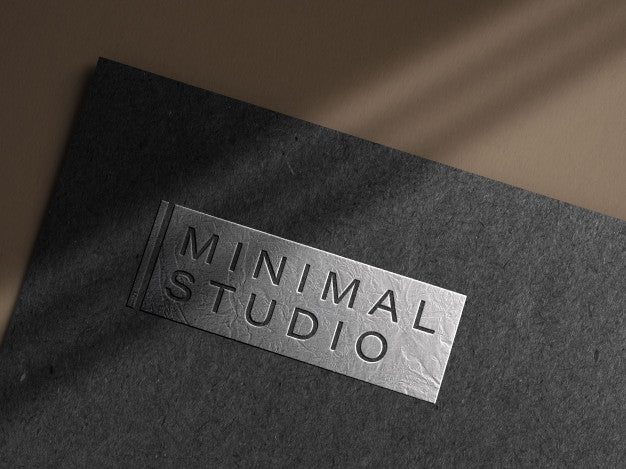 Embossed Silver Logo Mockup On Dark Paper Psd