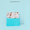 Envelope And Card Leaning Against Wall Psd