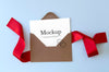 Envelope With Red Ribbon And Rings Mockup Psd