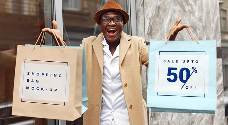 Excited Man Hand Holding Shopping Bags Mockup Psd