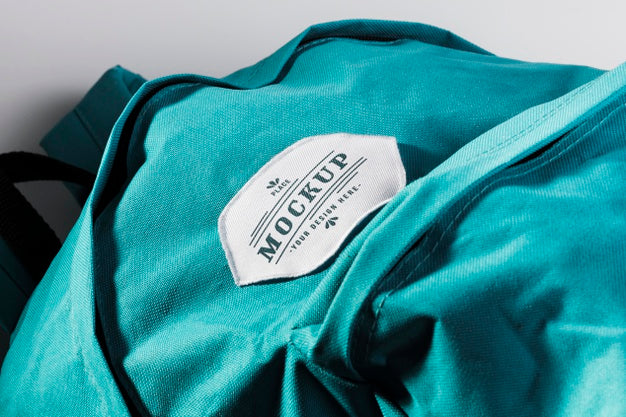 Fabric Clothing Patch Mock-Up On Blue Backpack Psd