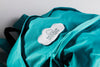Fabric Clothing Patch Mock-Up On Blue Backpack Psd