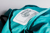 Fabric Clothing Patch Mock-Up On Blue Backpack Psd
