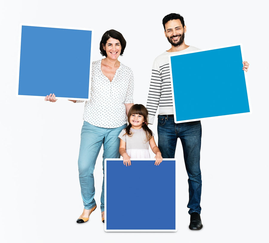 Family Holding Blue Square Boards