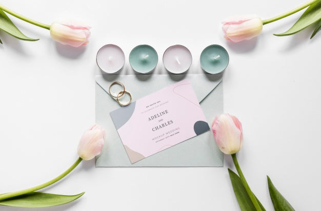 Fat Lay Of Wedding Card With Candles And Tulips Psd