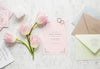 Fat Lay Of Wedding Card With Wedding Rings And Tulips Psd