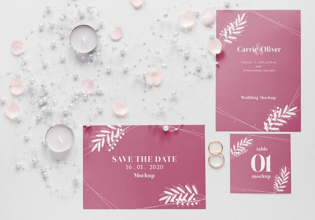 Fat Lay Of Wedding Cards With Candles And Rings Psd