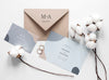 Fat Lay Of Wedding Cards With Rings And Cotton Psd