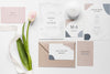 Fat Lay Of Wedding Cards With Tulips And Ribbon Psd