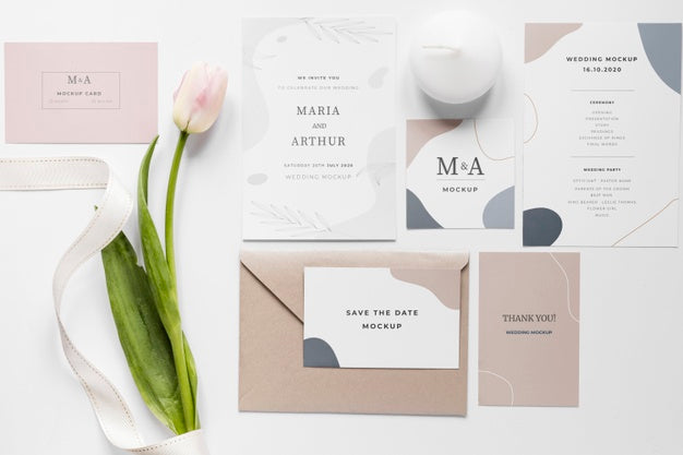Fat Lay Of Wedding Cards With Tulips And Ribbon Psd