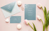 Fat Lay Of Wedding Cards With Tulips And Rings Psd