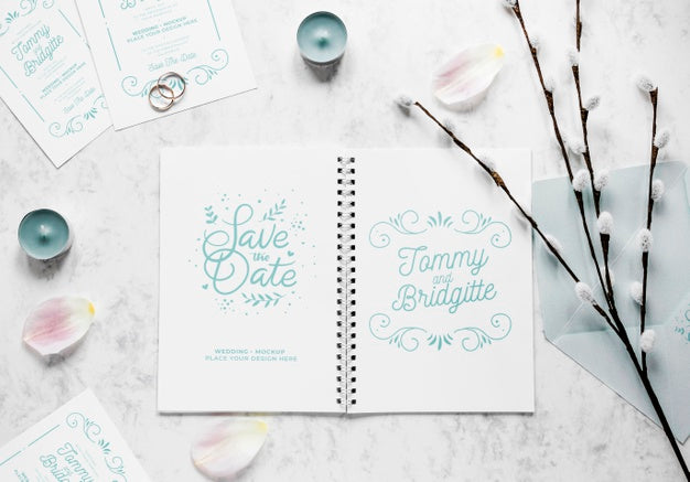 Fat Lay Of Wedding Notebook With Flowers And Candles Psd