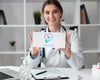 Female Doctor Holding A Mock-Up Card Psd