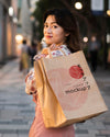 Female Walking Outdoors With Shopping Bag Psd