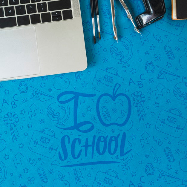 Flat Lay Arrangement With Laptop And Hole Puncher Psd