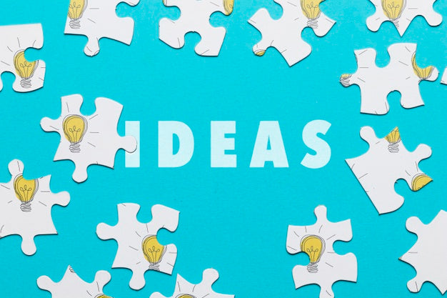 Flat Lay Arrangement With Puzzle Pieces On Blue Background Psd