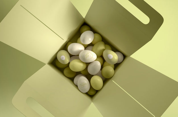 Flat Lay Box With White And Green Eggs Psd
