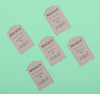 Flat Lay Eco Tags On Green Background Psd