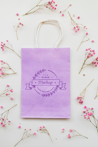 Flat Lay Flowers And Paper Bag Arrangement Psd