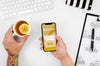 Flat Lay Hands Holding Smartphone Mock-Up And Tea Psd