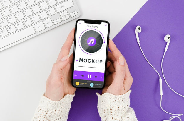 Flat Lay Hands Holding Smartphone Mock-Up With Earphones Psd