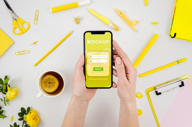 Flat Lay Hands Holding Smartphone Mock-Up With Tea Psd