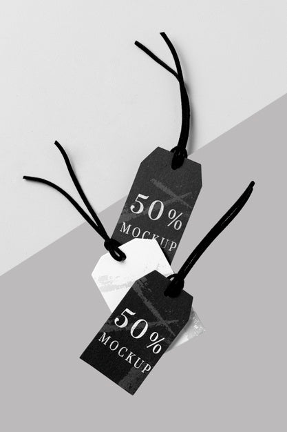 Flat Lay Mock-Up Arrangement Of Black And White Clothing Tags Psd