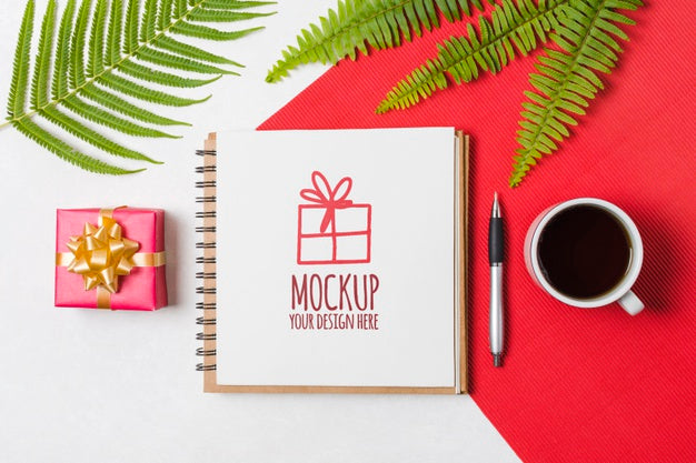 Flat Lay Notebook Mock-Up Next To Birthday Gift Psd