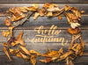 Flat Lay Of Autumn Leaves On Wooden Table Psd