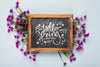Flat Lay Of Blackboard With Flowers Psd