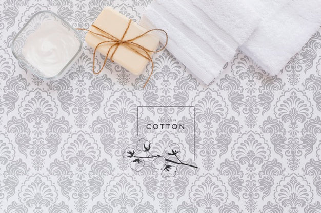 Flat Lay Of Body Butter And Soap In Plain Background Mock-Up Psd