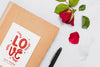 Flat Lay Of Book With Rose And Pen Psd