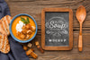 Flat Lay Of Bowl Of Vegetable Soup With Chalkboard Psd