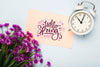 Flat Lay Of Card With Clock And Flowers Psd