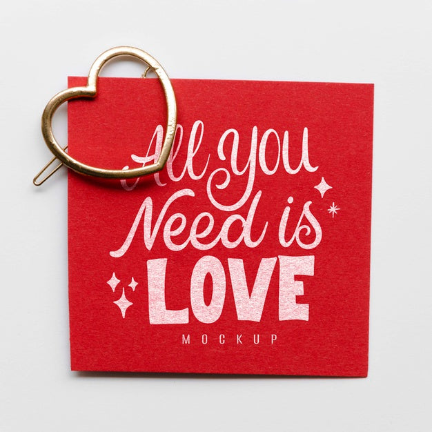 Flat Lay Of Card With Heart-Shaped Golden Pin Psd