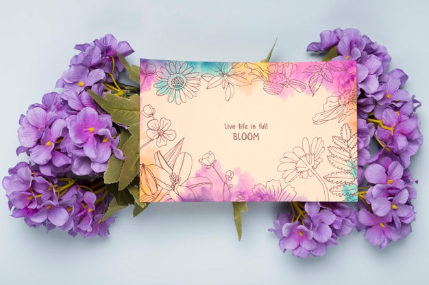 Flat Lay Of Card With Spring Flowers Psd