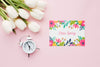 Flat Lay Of Card With Tulips And Clock Psd