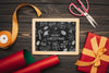 Flat Lay Of Christmas Concept Chalkboard On Wooden Table Psd