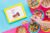 Flat Lay Of Colorful Cereals Bowls And Frame Psd