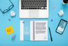 Flat Lay Of Desk Surface With Laptop And Smartphone Psd