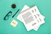 Flat Lay Of Desk Surface With Notebook And Glasses Psd