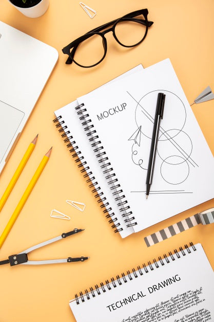Flat Lay Of Desk Surface With Notebook And Glasses Psd